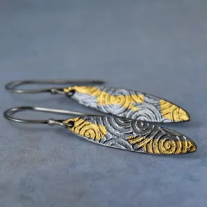 Silver and gold dangle earrings inspired by ancient spirals