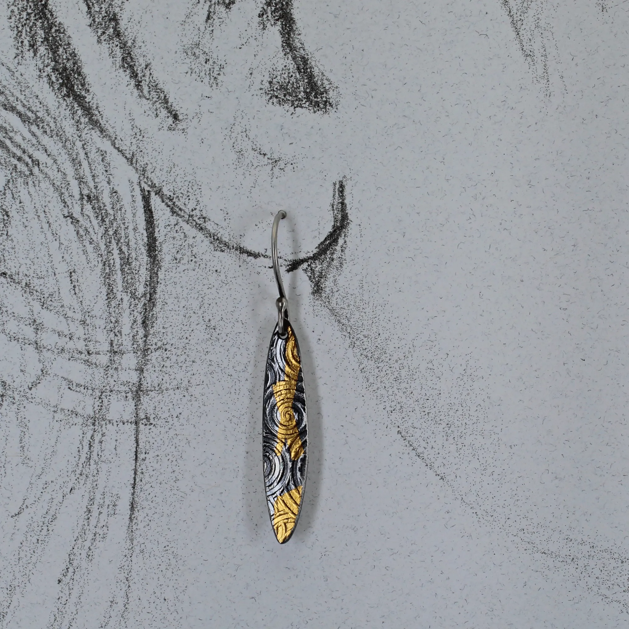 Silver and gold dangle earrings inspired by ancient spirals